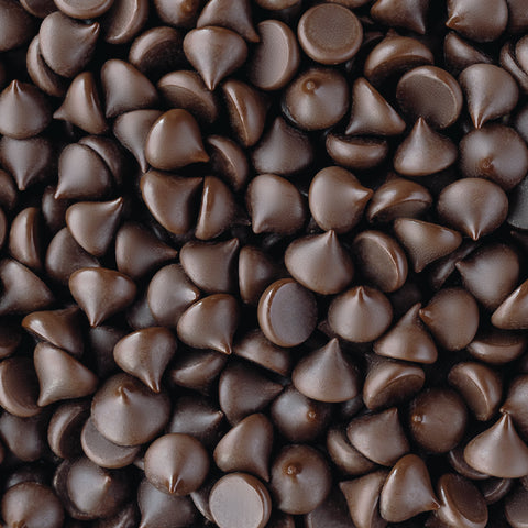 Shot of many bare dark chocolate chips close up