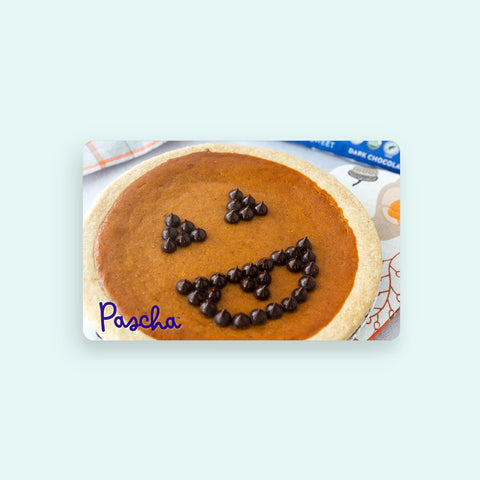 Pumpkin pie with chocolate chips shaped like a face on a Pascha card.