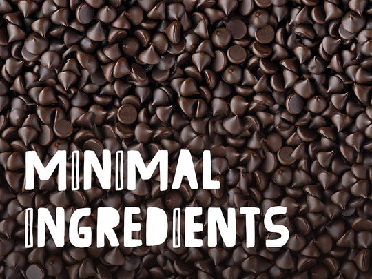 A sea of chocolate chips with MINIMAL INGREDIENTS written on the bottom left of the image