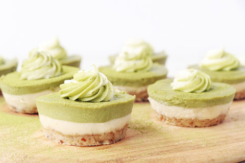 Vegan Matcha Cupcakes displayed on a wooden cutting board