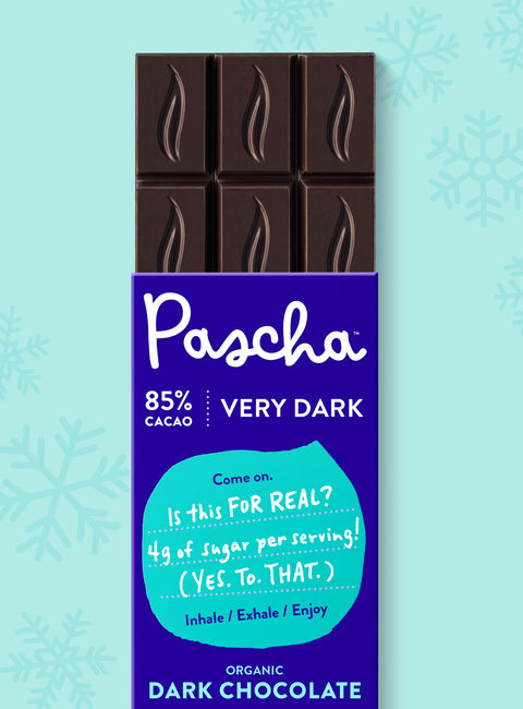 Pascha Chocolate 85% Cacao Very Dark Chocolate Bar with half of the bare chocolate bar coming out of the top