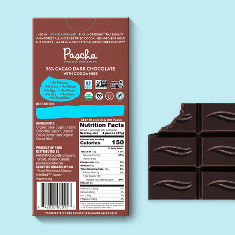 The back of Pascha chocolate's 55% cacao with cocoa nibs dark chocolate bar and bar of chocolate with bite taken out.