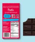 The back of Pascha chocolate's 70% cacao dark chocolate bar and bar of chocolate with bite taken out.