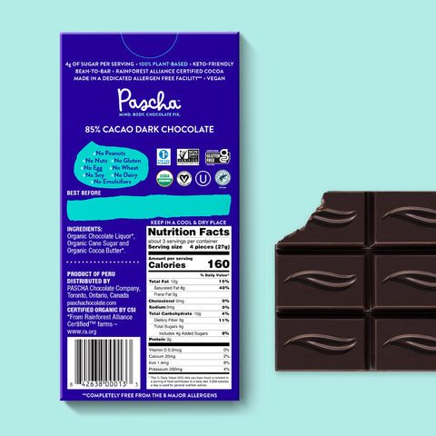 The back of Pascha chocolate's 85% cacao with dark chocolate bar and bar of chocolate with bite taken out.
