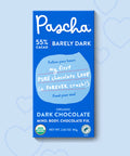 Pascha 55% Dark Chocolate Bar on a blue background with hearts