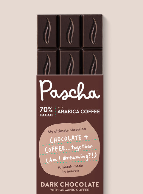 The front of Pascha Chocolate's 70% with arabica coffee Dark Chocolate Bar with half of the exposed bar sticking out of the top of the packaging
