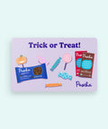 Pascha packaging with candy illustrations and 'Trick or Treat' on a light purple background on a card