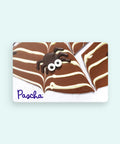 Dark Chocolate spider on a No Milk bark with white chocolate spiderweb lines with 'Pascha' logo on a card