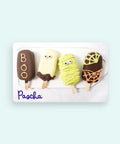 Four Halloween-themed fudgsicles on a white tray with 'Pascha' branding on a card.