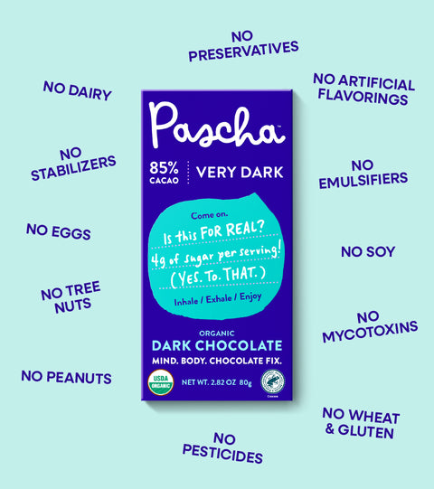 Pascha Chocolate's 85% Cacao Very Dark Chocolate bar surrounded by all of the things that Pascha is not or does not contain